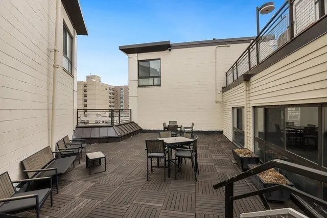 a view of balcony with furniture