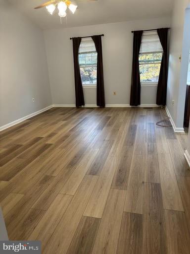 6803 Wild Rose Court Springfield, VA 22152 - Photo 5 of 49 an empty room with wooden floor and windows