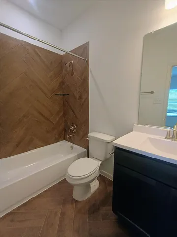 a bathroom with a sink a toilet and a bathtub