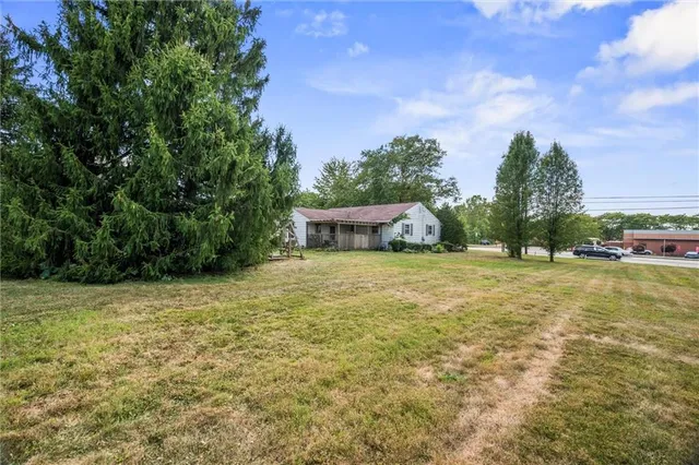 a backyard of a house with lots of green space