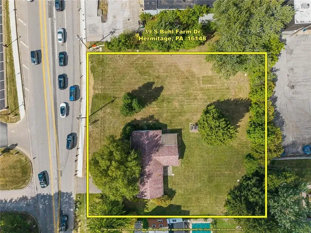 an aerial view of residential house with outdoor space