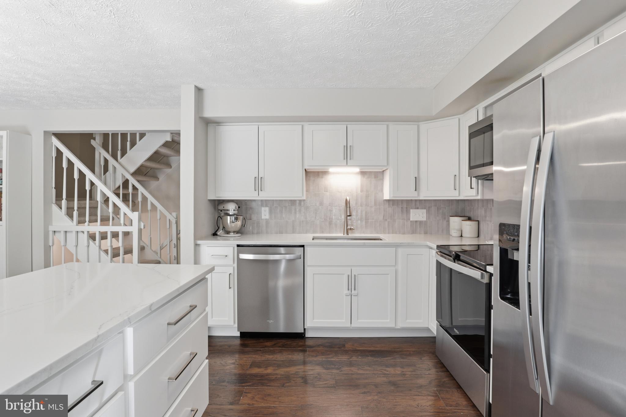 8033 Orange Plank Road Springfield, VA 22153 - Photo 2 of 26 White cabinets and granite counters