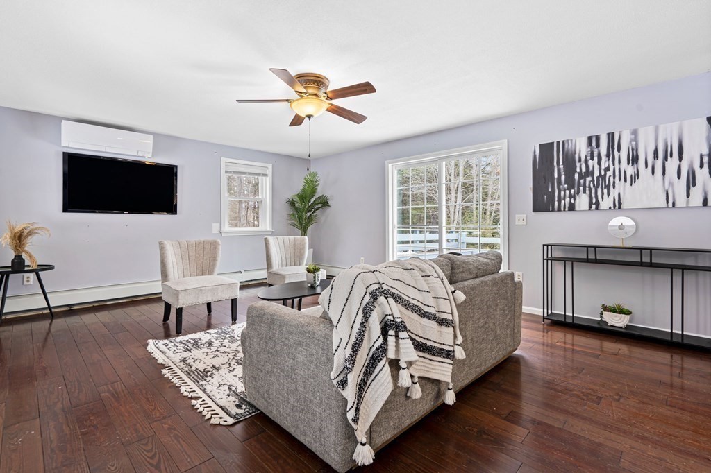 64 Gardner Road Winchendon, MA 01475 - Photo 11 of 40 a living room with furniture a flat screen tv and a large window