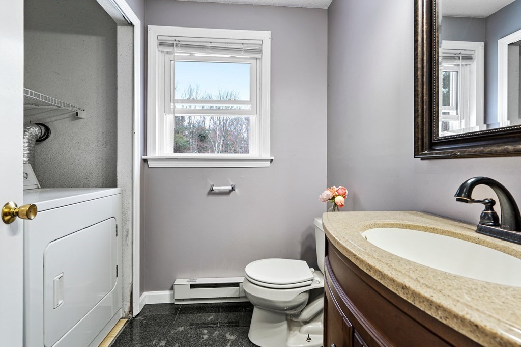 64 Gardner Road Winchendon, MA 01475 - Photo 12 of 40 a bathroom with a granite countertop toilet sink and mirror