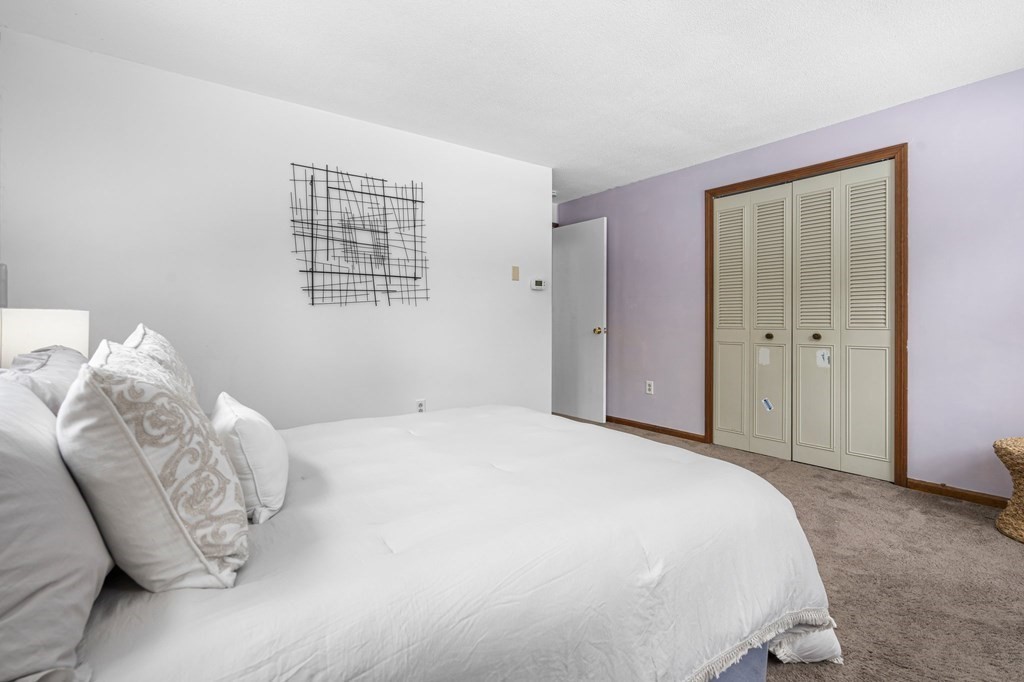 64 Gardner Road Winchendon, MA 01475 - Photo 21 of 40 a spacious bedroom with a bed and a window