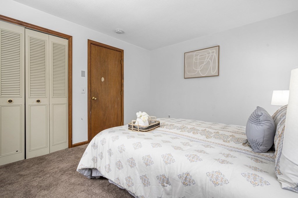 64 Gardner Road Winchendon, MA 01475 - Photo 23 of 40 a bedroom with a bed and lamp