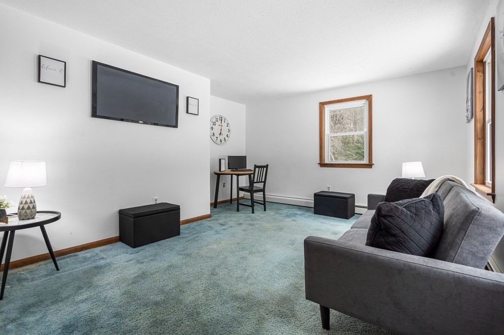 64 Gardner Road Winchendon, MA 01475 - Photo 3 of 40 a living room with furniture and a flat screen tv