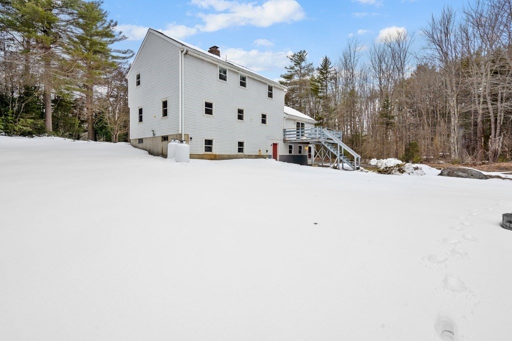 64 Gardner Road Winchendon, MA 01475 - Photo 36 of 40 a view of white house with a snow on the road