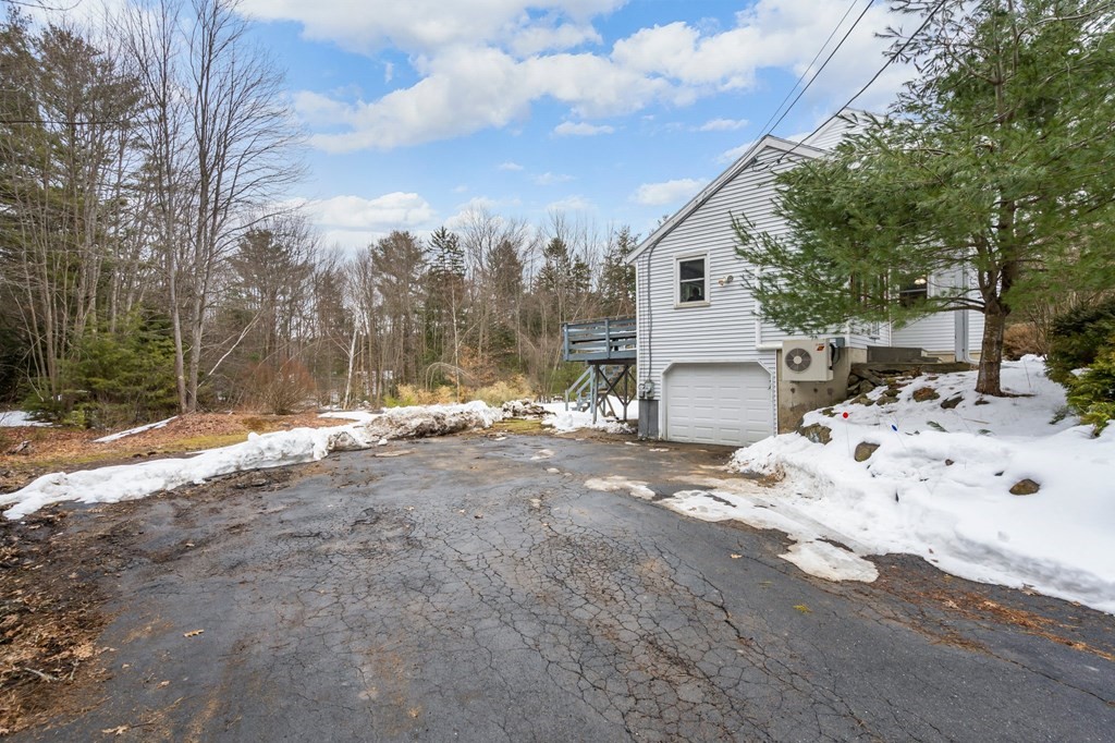 64 Gardner Road Winchendon, MA 01475 - Photo 38 of 40 a view of a white house with a snow on the road