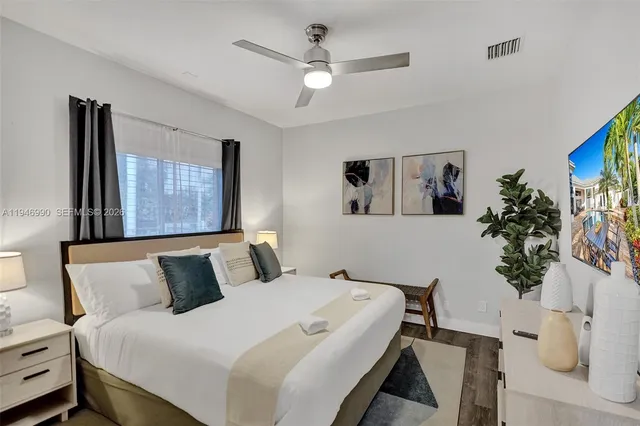 a bathroom with a sink a toilet a shower and a mirror