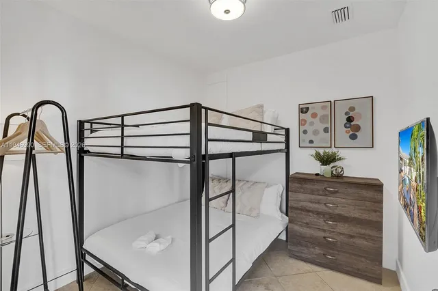 a view of a swimming pool with chairs