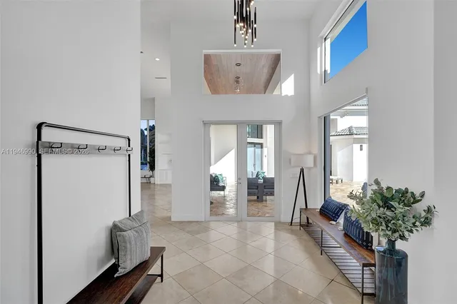 a living room with furniture and potted plant