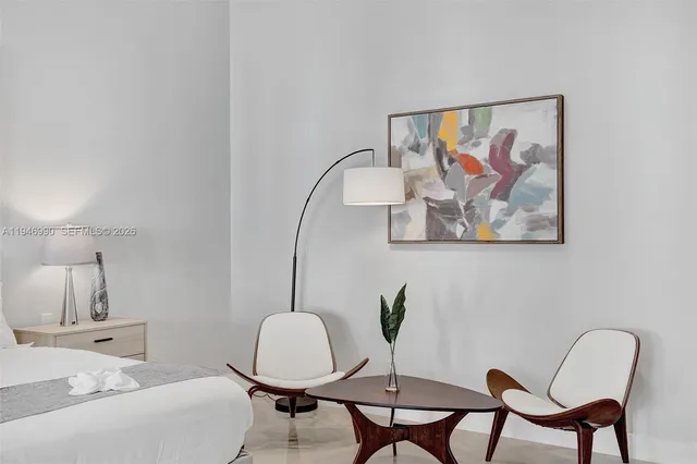 an aerial view of a house with garden space and swimming pool