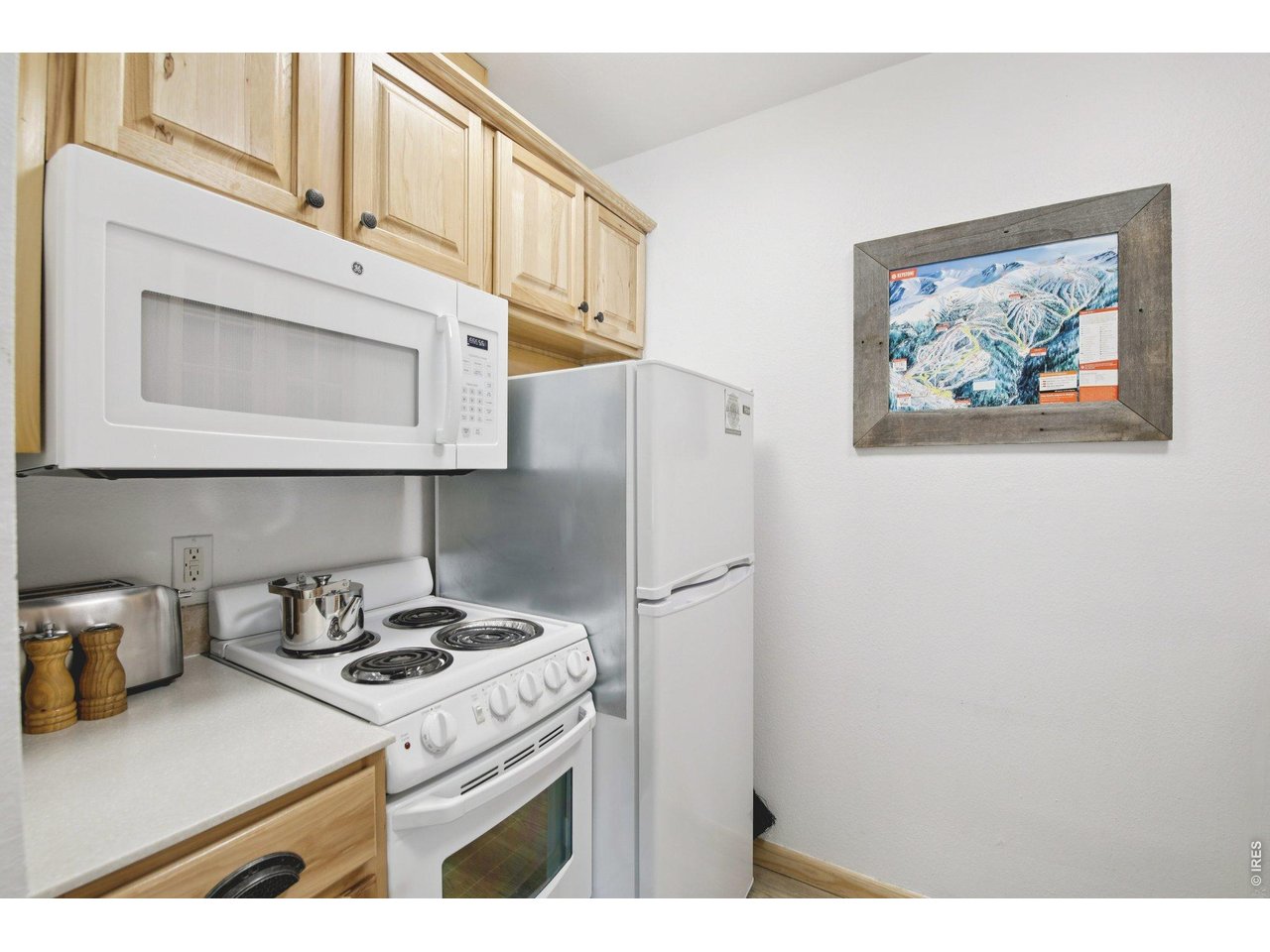 1937 Soda Ridge Road, Unit 1146 Dillon, CO 80435 - Photo 13 of 30 a kitchen with stainless steel appliances granite countertop white cabinets a stove a sink and dishwasher