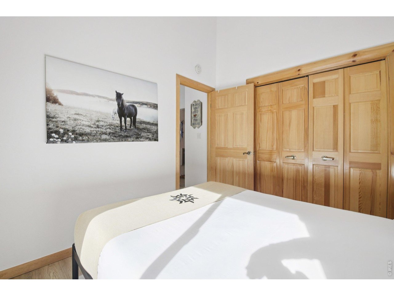 1937 Soda Ridge Road, Unit 1146 Dillon, CO 80435 - Photo 18 of 30 a bedroom with a bed and painting on the wall