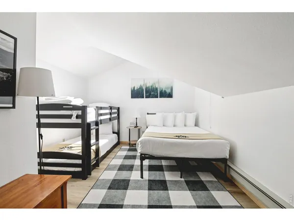 a view of a building with snow on the road