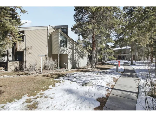 a view of a house with swimming pool and a yard