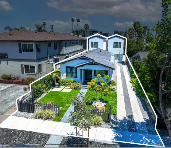 a front view of a house with garden
