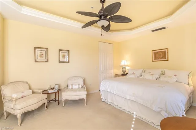 a bedroom with a bed and a couch