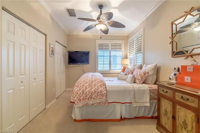 a bedroom with a bed and a tv