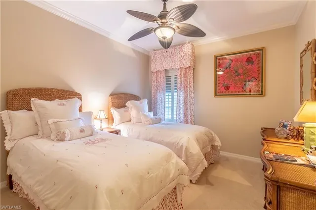 a bedroom with double bed and a window