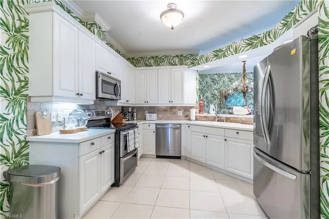 a kitchen with a refrigerator sink and microwave