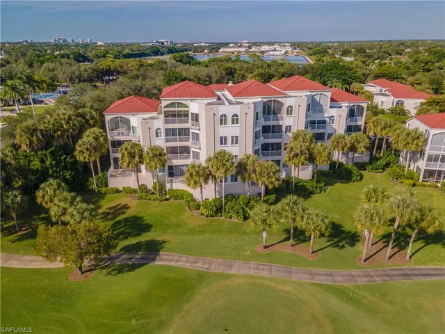 a front view of a residential houses with yard