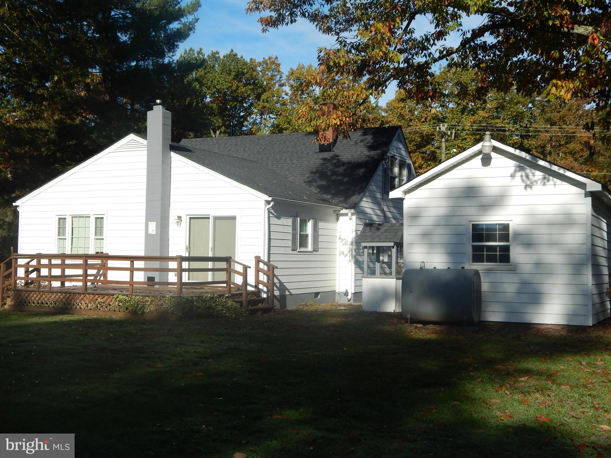 49 Duval Road Mineral, VA 23117 - Photo 20 of 22 a roof deck with table and chairs with wooden floor