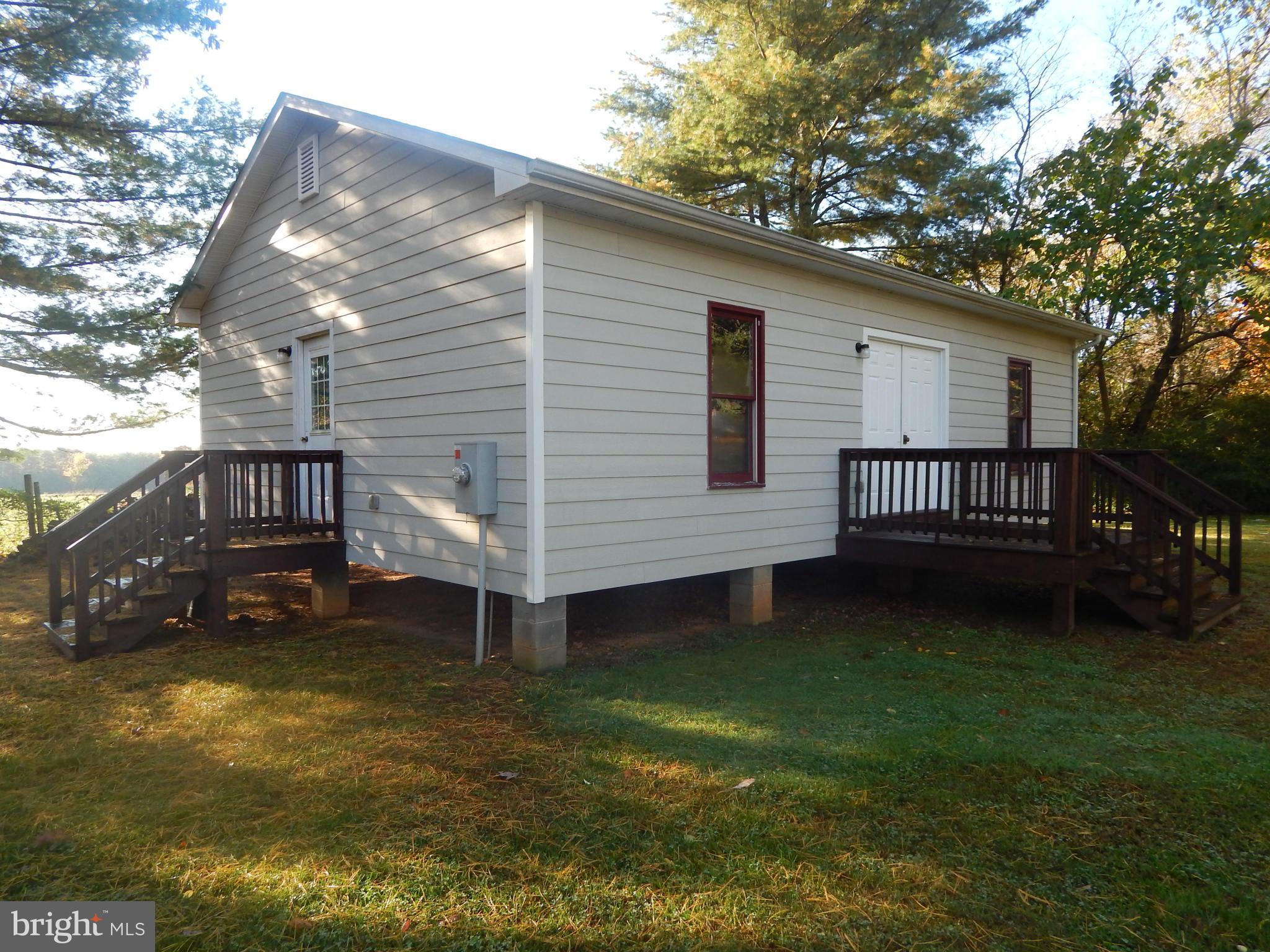 49 Duval Road Mineral, VA 23117 - Photo 22 of 22 a view of a house with a yard