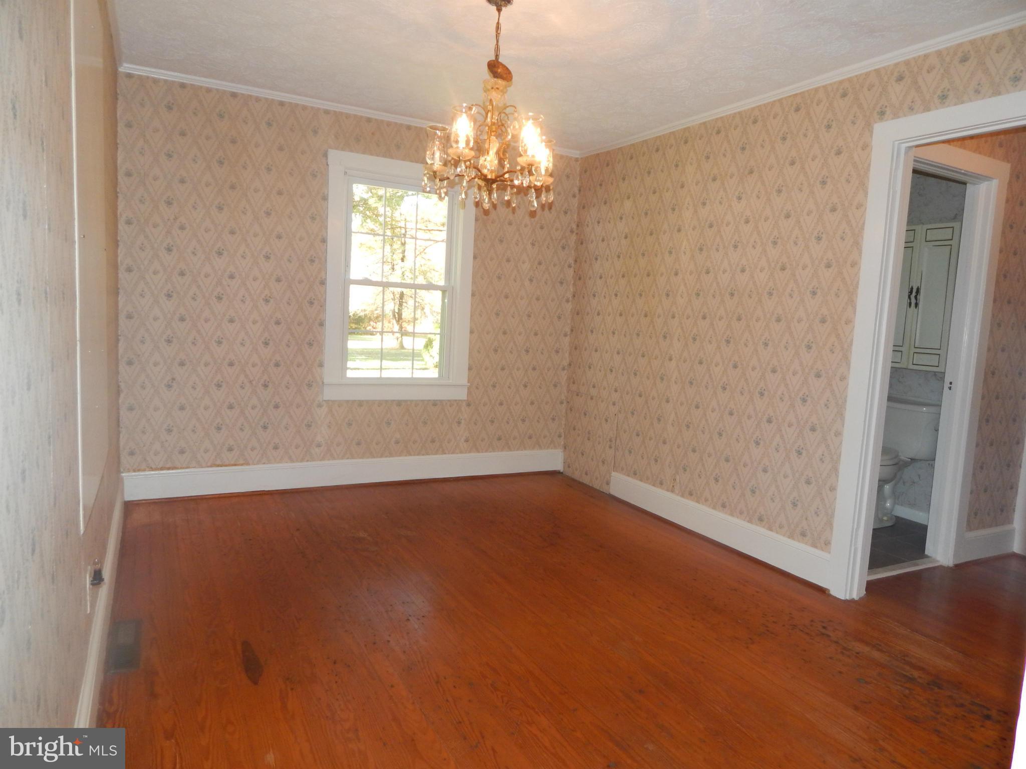 49 Duval Road Mineral, VA 23117 - Photo 6 of 22 an empty room with chandelier fan and windows