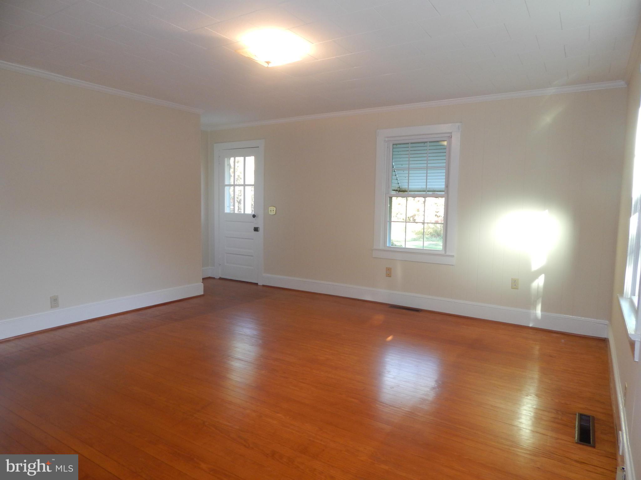 49 Duval Road Mineral, VA 23117 - Photo 9 of 22 an empty room with wooden floor and windows