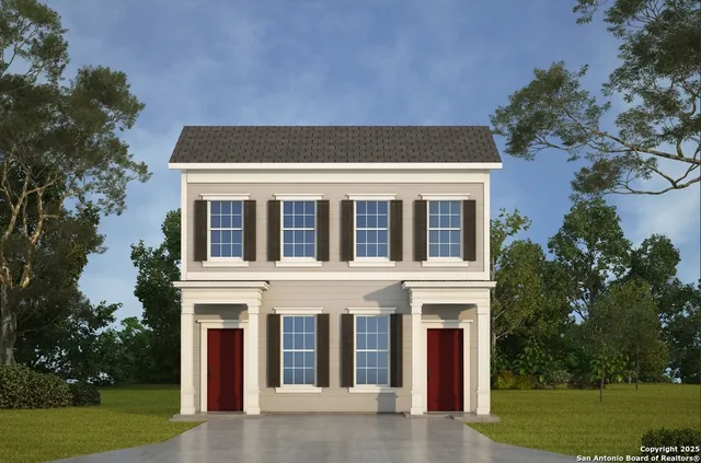 a view of a white house with a yard and plants