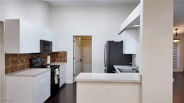 a kitchen that has a sink and a stove