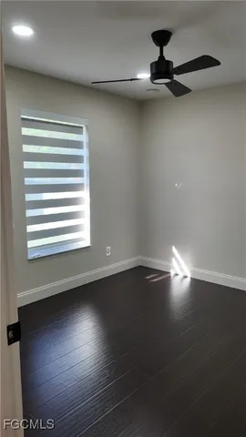 a view of room with hardwood floor and window
