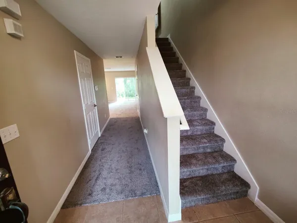 a view of a bathroom with sink and mirror