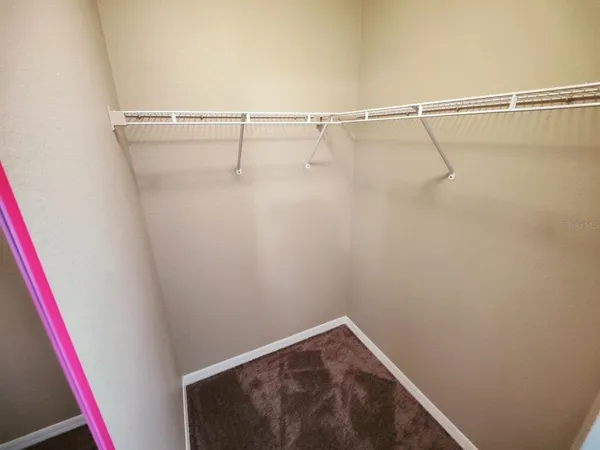 a view of hallway with wooden floor