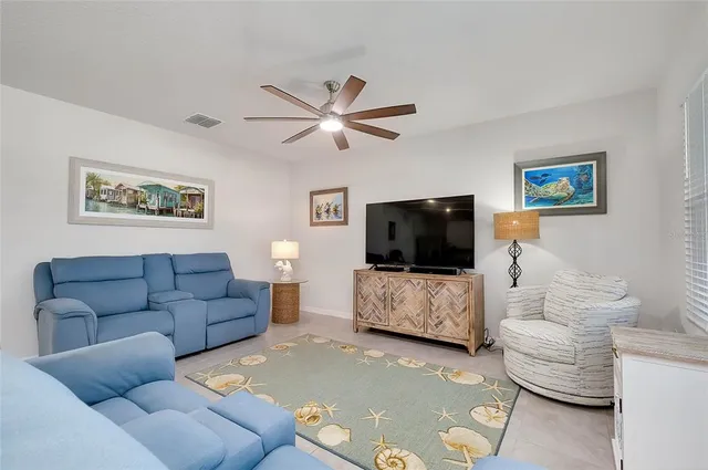 a large kitchen with stainless steel appliances granite countertop a sink dishwasher stove and microwave