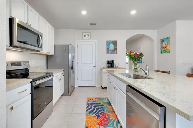 a very nice looking living room with a couch and a flat screen tv