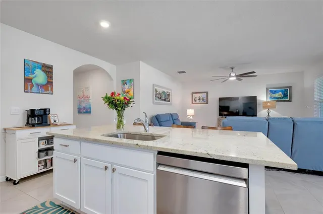 a dining room with furniture and a window