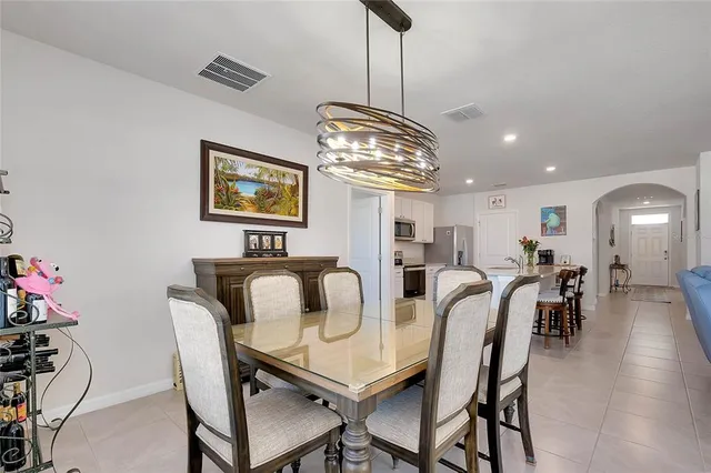 a bathroom with a toilet and a shower curtain