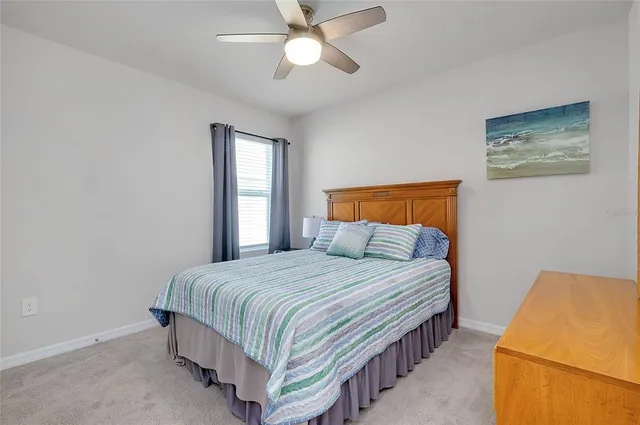 a view of a patio with a table and chairs under an umbrella