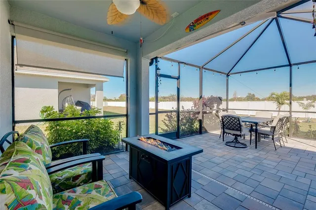 an aerial view of a house with a garden and swimming pool