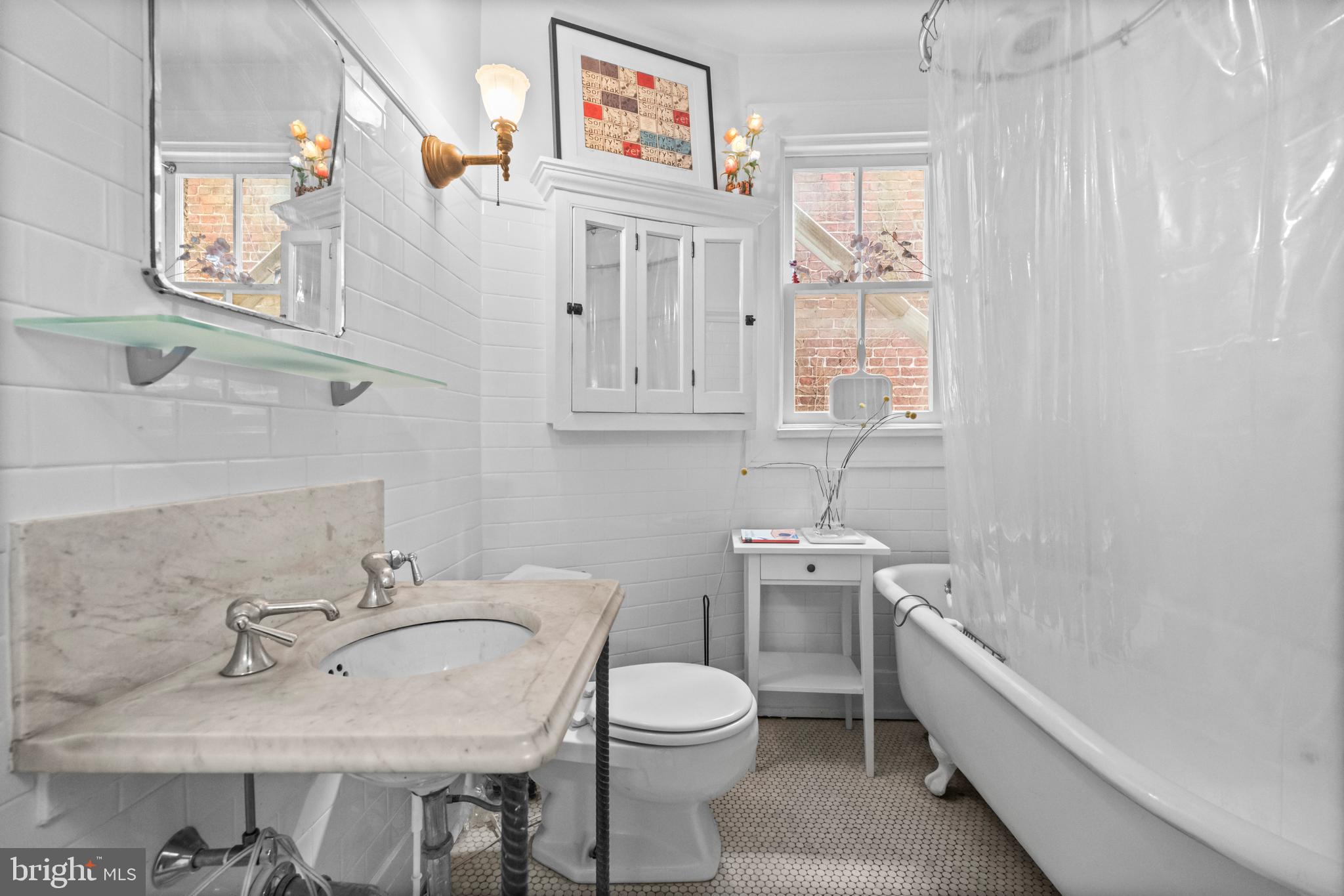 2516 Cliffbourne Place Northwest Washington, DC 20009 - Photo 23 of 34 a bathroom with a sink a toilet and shower