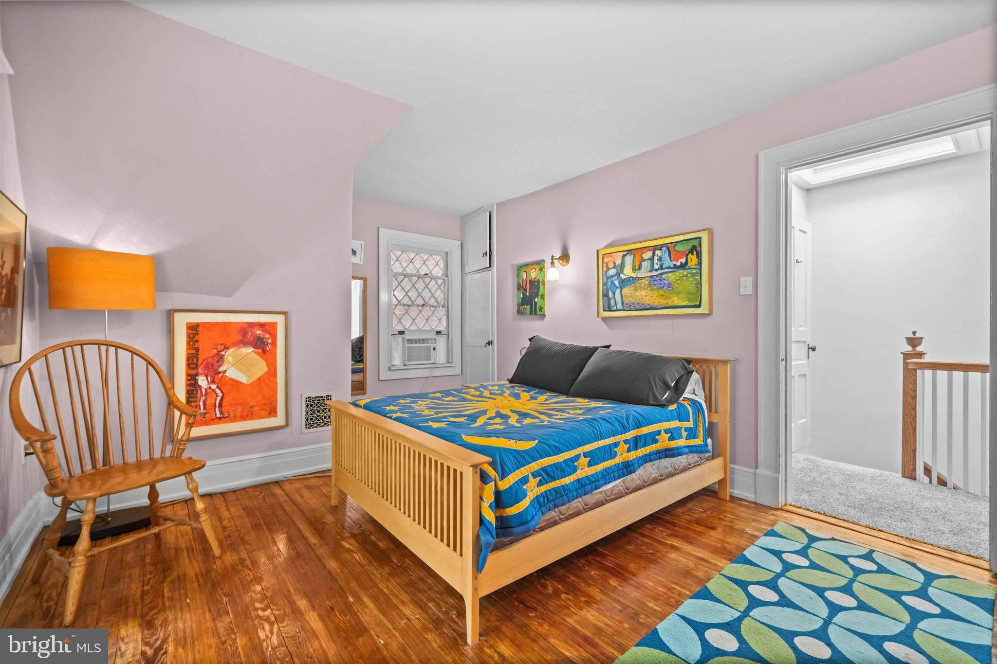 2516 Cliffbourne Place Northwest Washington, DC 20009 - Photo 24 of 34 a bedroom with a bed and wooden floor