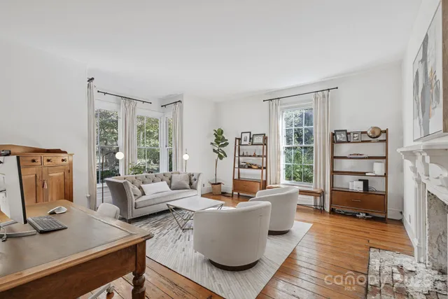 a view of staircase with lots of white walls and a window