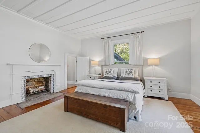 a bedroom with bed and a window