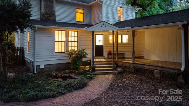 a view of a ground with large trees