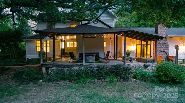 an aerial view of a house with a yard and garden