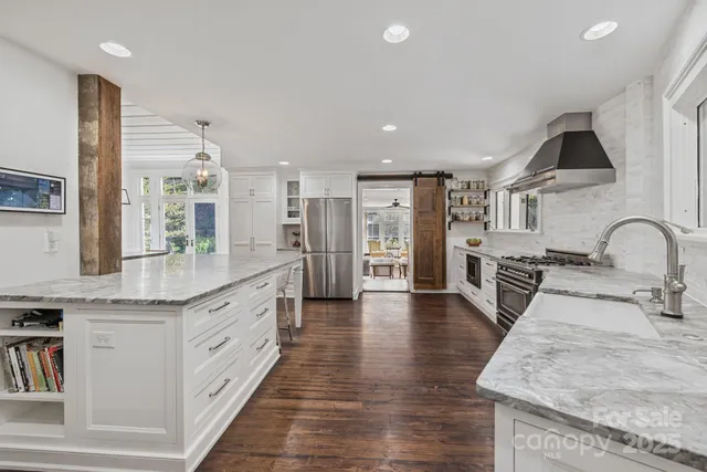 a large white kitchen with lots of counter space