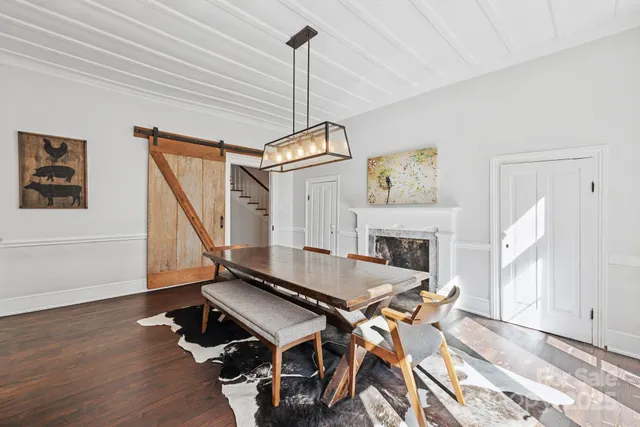 a living room with fireplace furniture and a flat screen tv